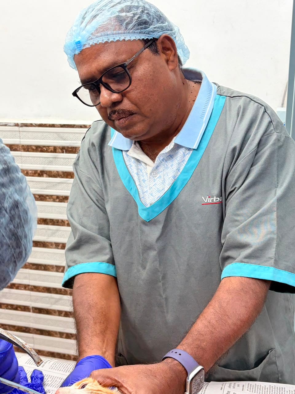 Dr. Shivaji Vidhate at work in the clinic